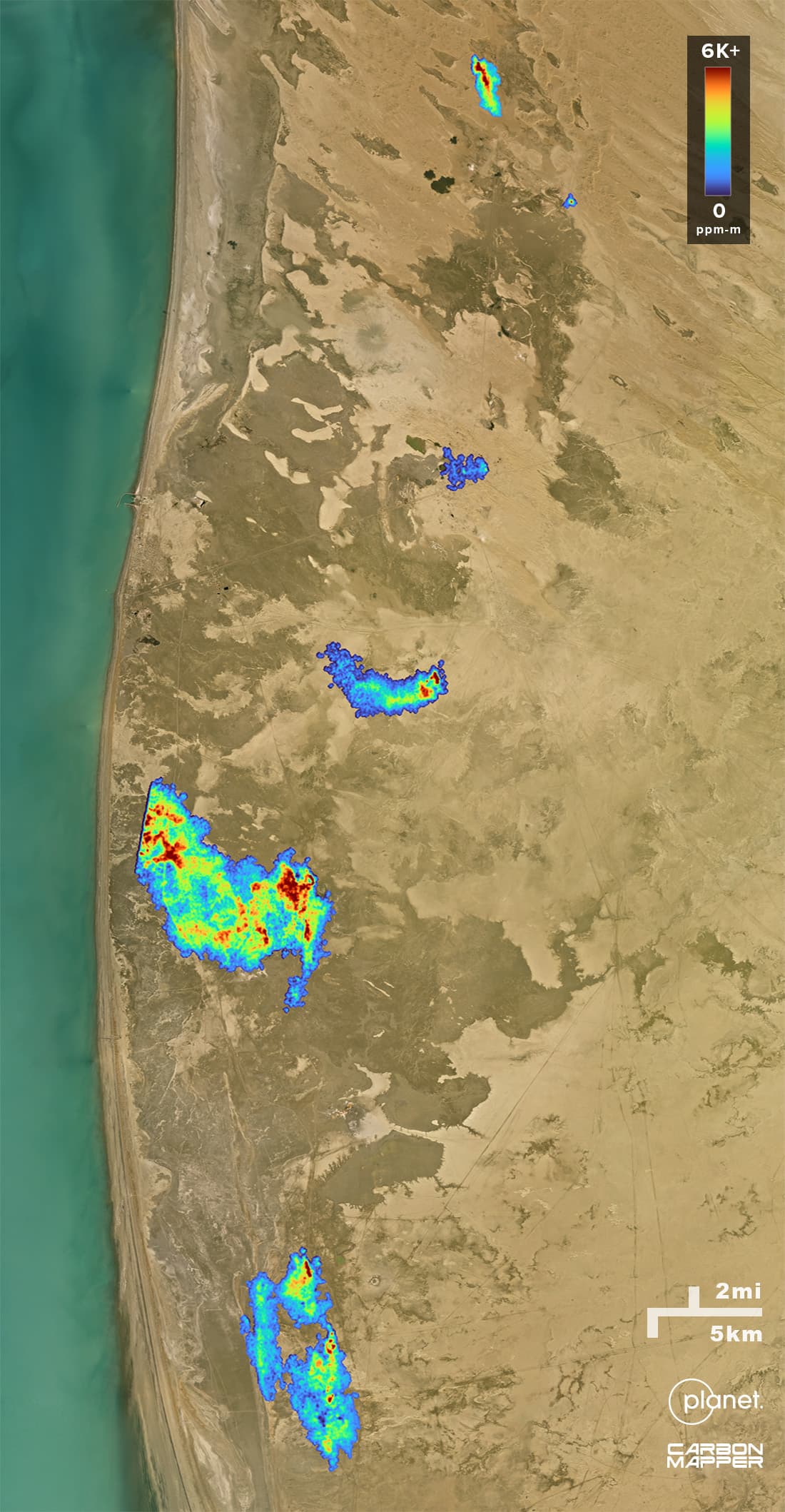 On the background of a satellite image, methane plumes can be seen across a stretch of the Turkmenistan coast. They are colored with a gradient that matches the methane emissions intensity of each plume's emissions.