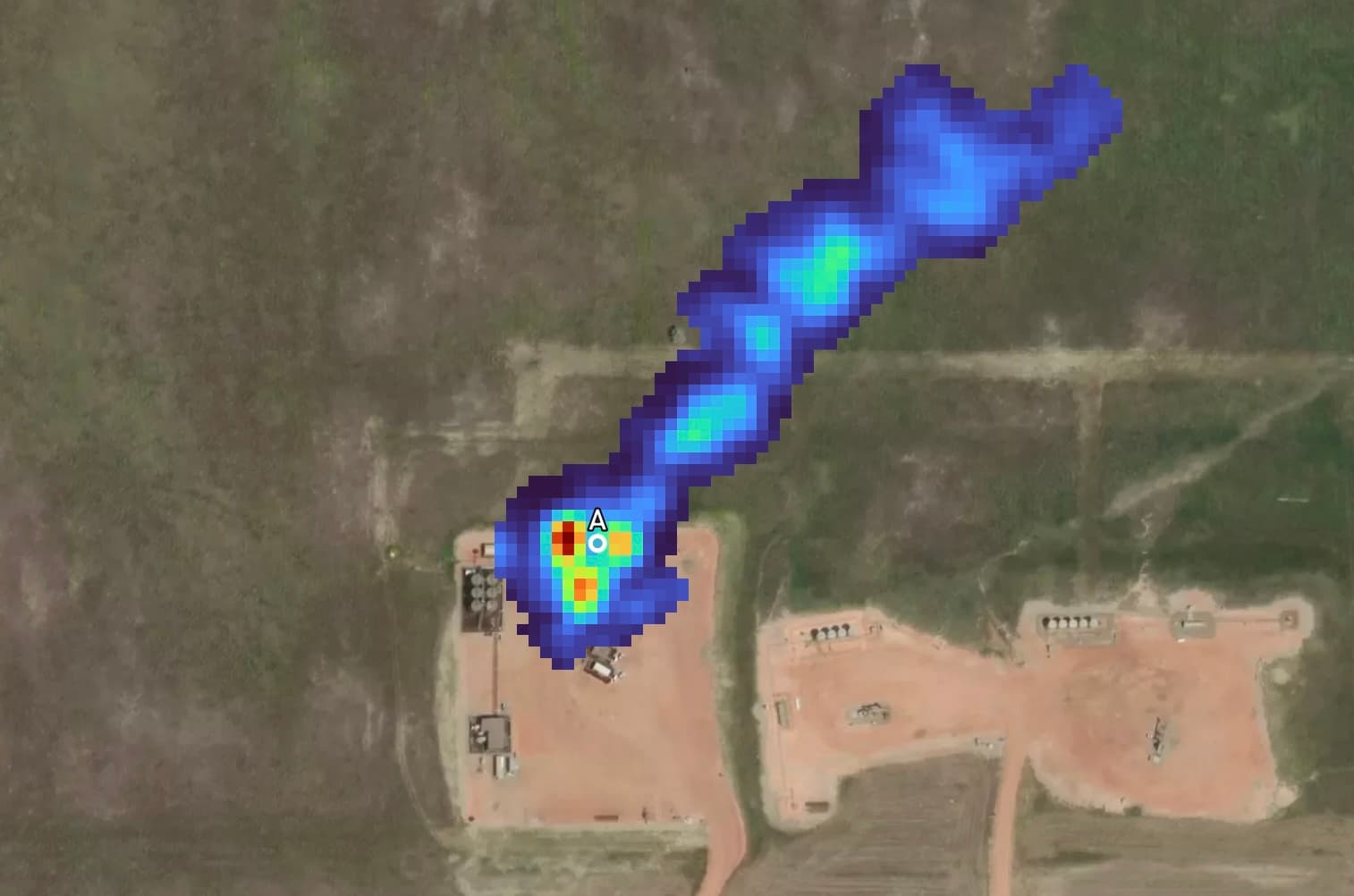 a methane plume from oil and gas flaring is spotted in Western Iran. The plume is a gradient color to demonstrate the emission rate, and it's located on a satellite background, picture emitting from its source.